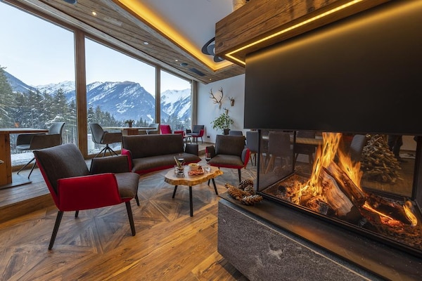 Foto van Alpenchalet met uitzicht op de bergen - Vakantiehuis in Neukirchen - LivingRoom