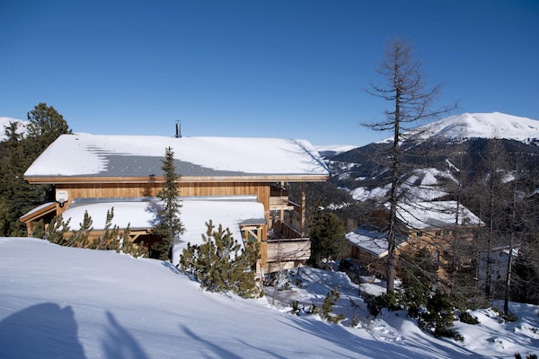 Foto van Vrijstaand chalet in Turracherhöhe met een sauna - Vakantiehuis in Turracherhöhe - ExteriorWinter