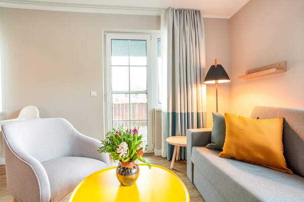 Foto van Vakantiecomplex BEECH Resort Fleesensee, Göhren-Lebbin - LivingRoom