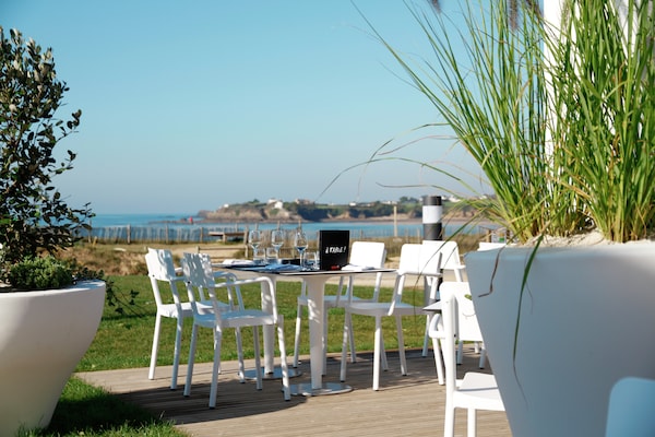 Foto van Appartement aan zee met zwembad - Vakantiehuis in Guidel - TerraceBalcony