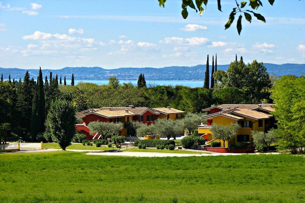 Foto van Appartementen Poiano in Garda met zwembad - Vakantiehuis in Garda - ExteriorSummer