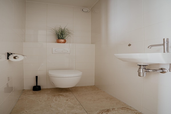 Foto van Appartement in Egmond met Uitzicht op Zee - Vakantiehuis in Egmond aan zee - BathRoom