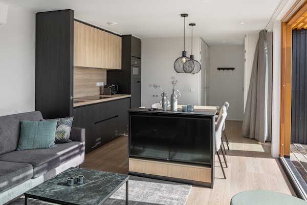 Foto van Lodge bij Brouwersdam & Noordzeestrand - Vakantiehuis in Scharendijke - LivingRoom