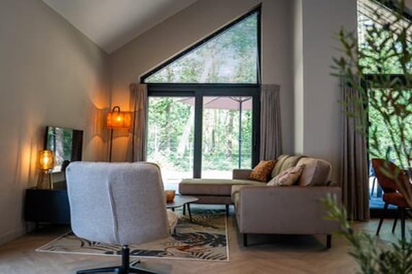 Foto van Ecovilla met uitzicht op het bos voor 6 personen - Vakantiehuis in Oirschot - LivingRoom