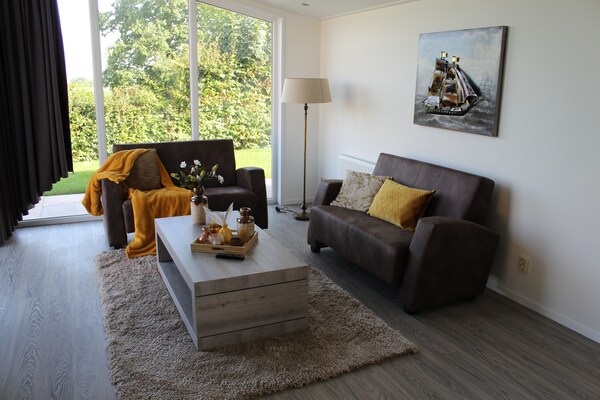 Foto van Gezellige tuinwoning met open haard - Vakantiehuis in Bemelen - LivingRoom