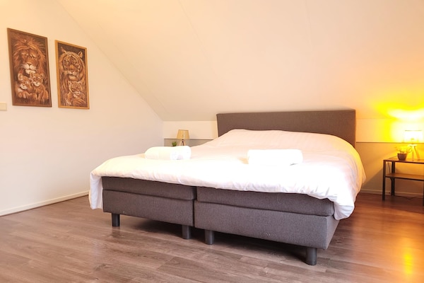 Foto van Huisdiervriendelijke bungalow bij het bos - Vakantiehuis in Ewijk - BedRoom